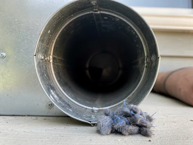 Tamarac Dryer Vent Cleaning technician using specialized equipment to clear severe dryer vent blockage in Tamarac